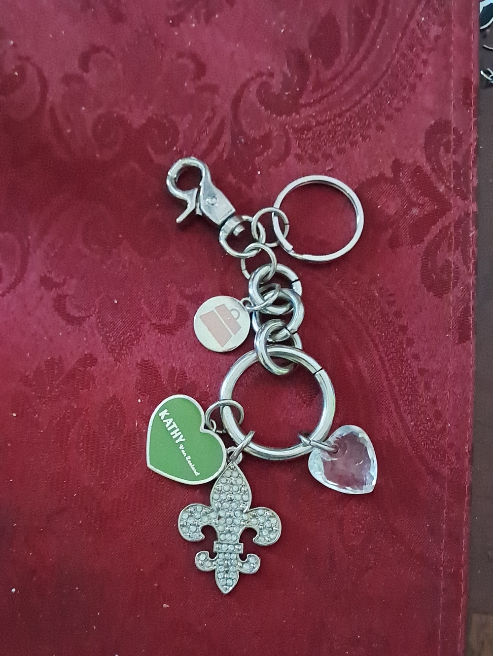 Kathy Van Zeeland Silver Fleur-de-Lis Keychain with Green Heart and Clear Charm